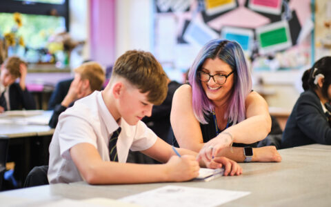 Art teacher with student