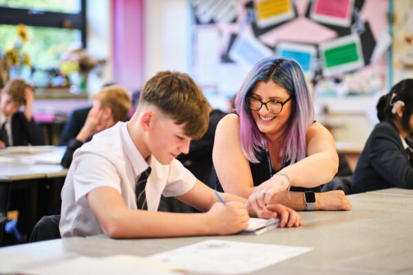 Art teacher with student