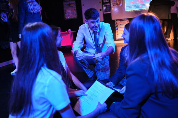 Drama teacher with students