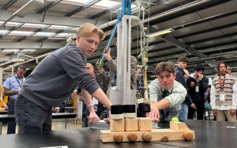 two engineering students with lift