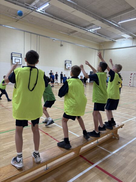 Year 7 boys playing sport in gym