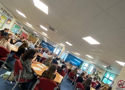 Post 16 students in common room watching presentation