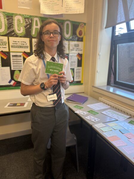 student with flashcard