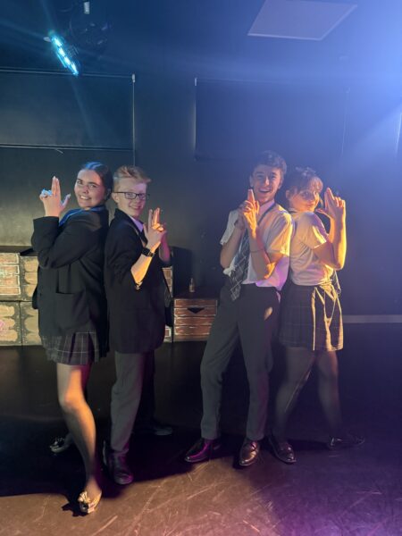 Four drama students posing