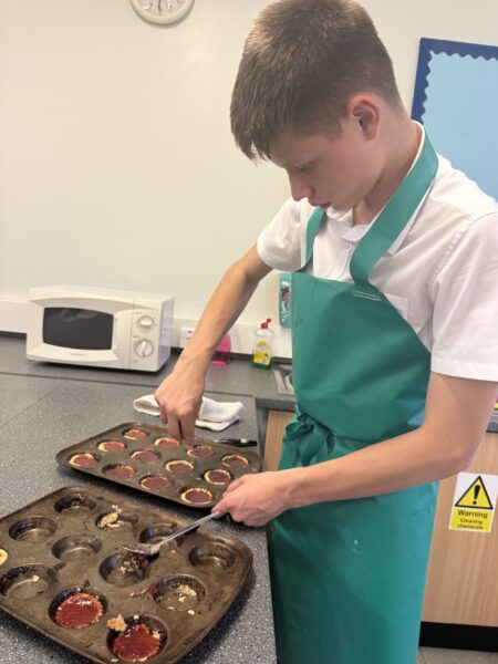 DT food technology student with jam tarts