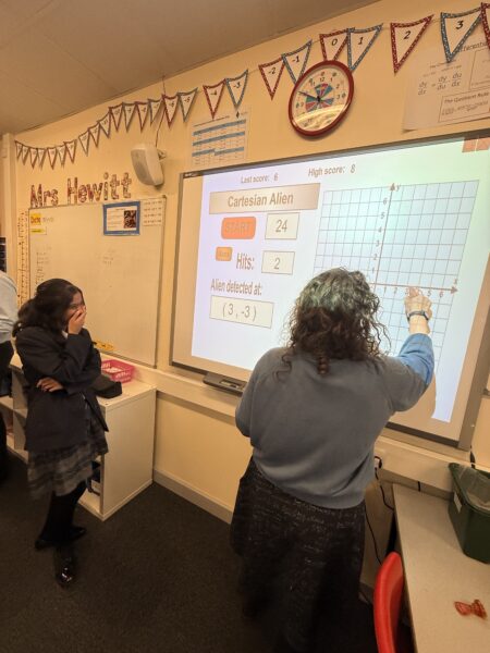 maths teacher completing white screen maths challenge