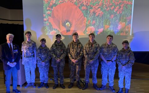 Students in army uniform with Mr Nichol