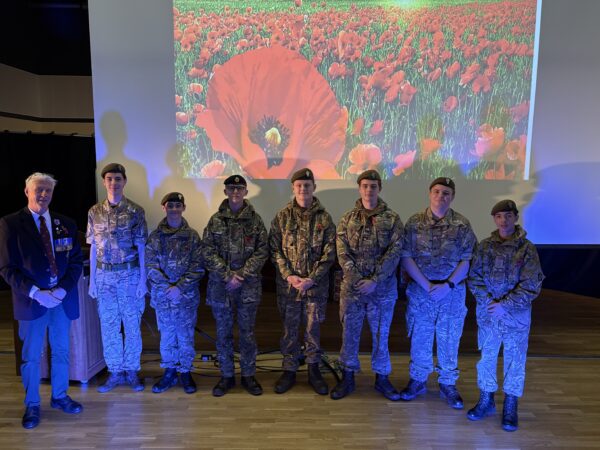 Students in army uniform with Mr Nichol