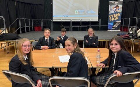 STEM students sitting around a table